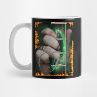 My hand forming the F chord. Mug